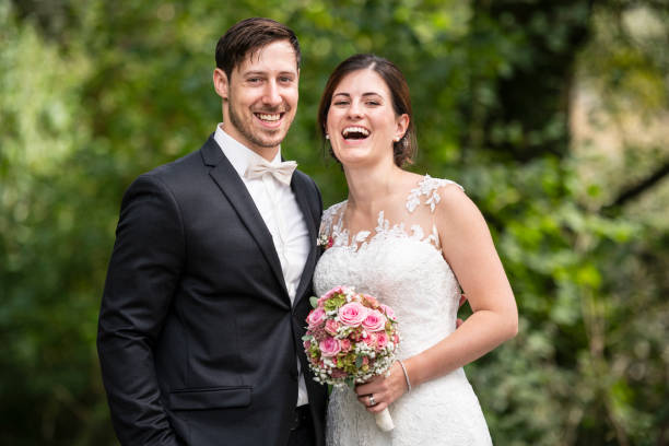 istock Just married bride and groom smiling at camera 1137427147