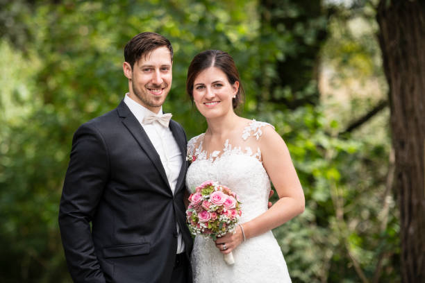 istock Just married bride and groom smiling at camera 1137427148