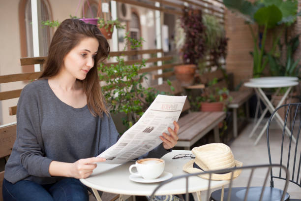 istock woman reading at cafe 1137427923