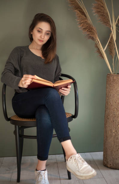 istock woman reading at cafe 1137429529