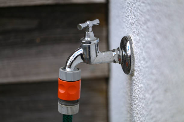 Water tap for watering in the garden stock photo