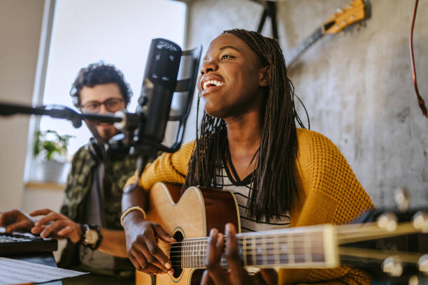 African woman singing at recording studio