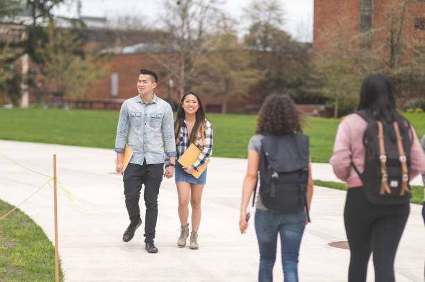 istock College students walking across campus to their classes 1137445709
