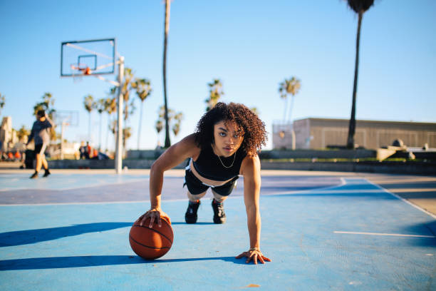 istock Low angle portrait of a young women doing one hand push ups 1137447579