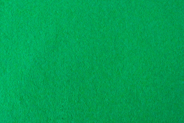 istock Green Coloured Felt Texture. Seamless Square Background. Surface of fabric texture. 1137448411