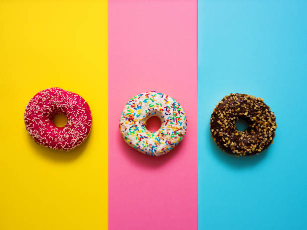 istock Sweet donuts on mmulti colored background 1137453982