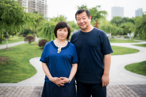 istock Chinese couple in a park 1137457348