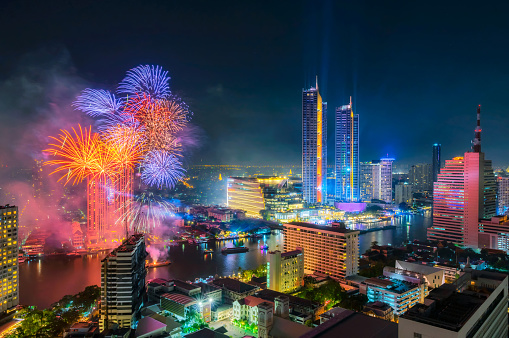 Landscape of Bangkok city with Fireworks, Happy new year countdown at the Chao Phraya River, Thailand.