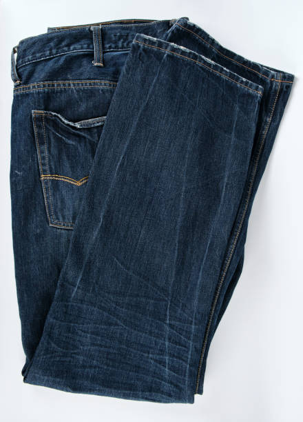 istock folded blue men's jeans on a white background 1137463136