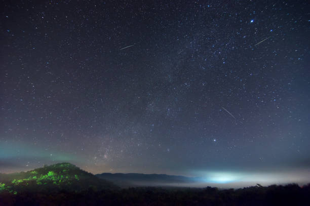 istock Milky way on hill with Leonid meteor shower. 1137463179