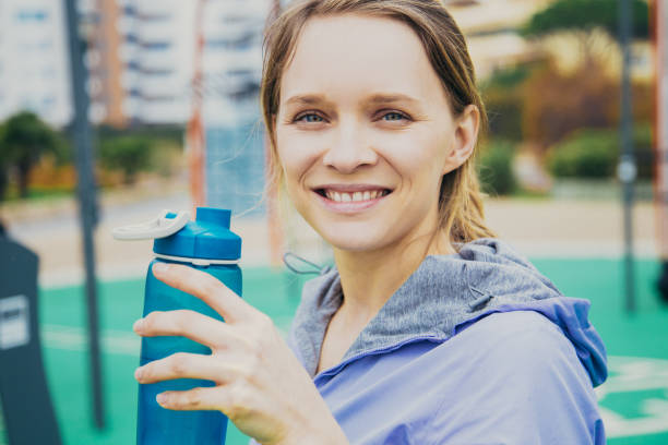 istock Positive athlete enjoying water 1137465374