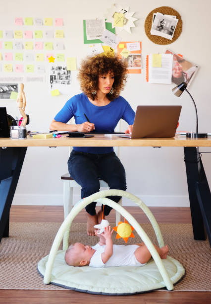 Working Mother Balancing Baby and Design Work