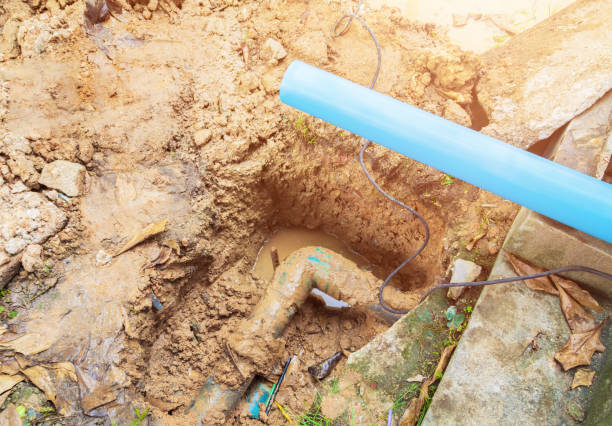 istock broken pipe in hole with water motion at roadside wait repair 1137468824