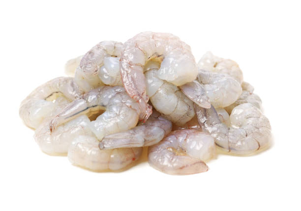 Raw Jumbo Shrimp on a White Background Raw Jumbo Shrimp on a White Background peeled stock pictures, royalty-free photos & images