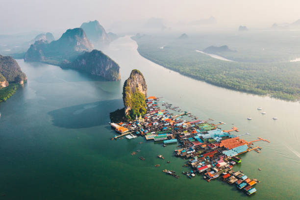 Scenic aerial view of floating village Ko Panyi in Thailand Scenic aerial view of floating village Ko Panyi, Phang Nga, Thailand phang nga bay stock pictures, royalty-free photos & images