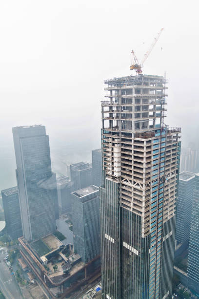 Skyscrapers construction site in foggy day