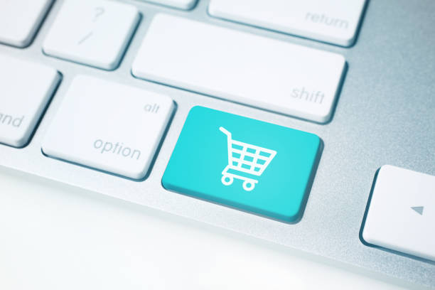 Shopping Cart Icon on Computer Keyboard Close-up of shopping cart icon on computer keyboard button. easy button image stock pictures, royalty-free photos & images