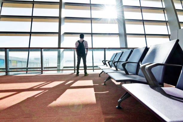 istock Man with backpack waiting in airport 1137485317