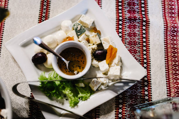 istock The holiday table with appetizer cheese, snacks. Served table with food. Festive table. Wedding table, food. Table at restaurant before starting to celebrate. New Year, Christmas, Valentine's Day. 1137487077