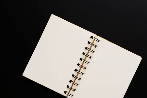 istock Design concept - Top view of empty kraft notebook on black background. mock up. 1137487224