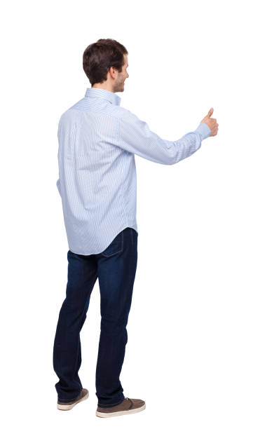 istock Back view of a man showing thumb up. 1137487336