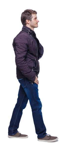 istock Side view of going handsome man in jeans and jacket. 1137491632