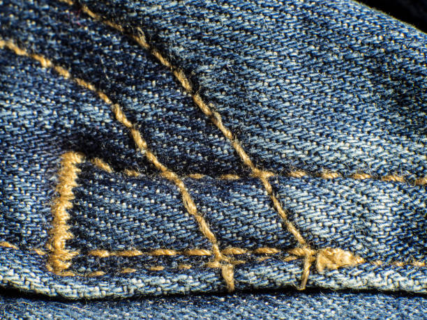 istock yellow seam on jeans trousers 1137492364
