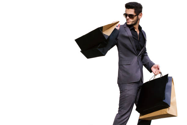 istock Handsome man in suit with shopping bags 1137495097