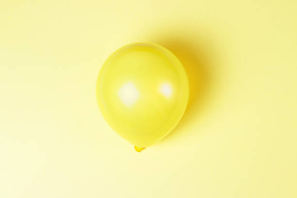 istock Balloon on a yellow background close up, holiday concept 1137495180