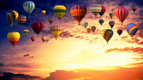 istock Hot air balloon above high mountain at sunset 1137495258