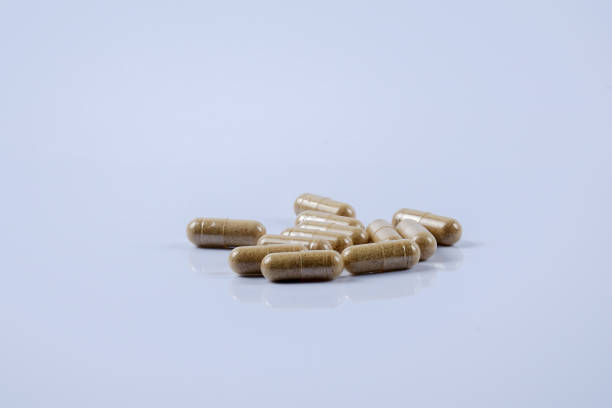 istock Close-Up Of Capsules On Blue Background 1137503802
