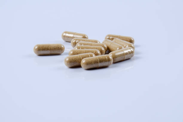 istock Close-Up Of Capsules On Blue Background 1137503809
