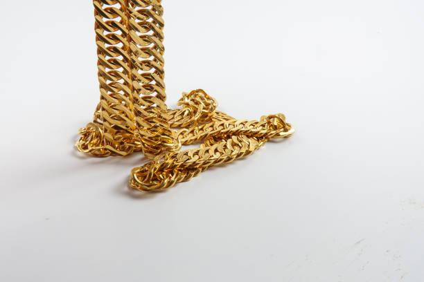 istock High Angle View Of Gold Chain Against White Background 1137505260