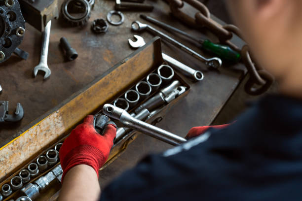istock Mechanical engineer connecting a socket to a ratchet on a industrial work bench 1137507551