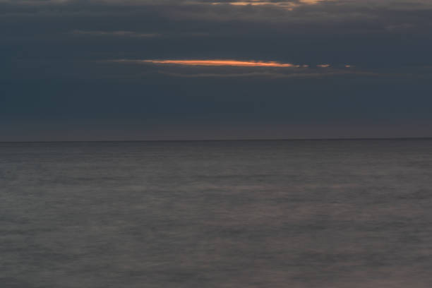 istock Single Open Space in a Cloud Bank with Orange Sunset on the Mediterranean Sea 1137510694