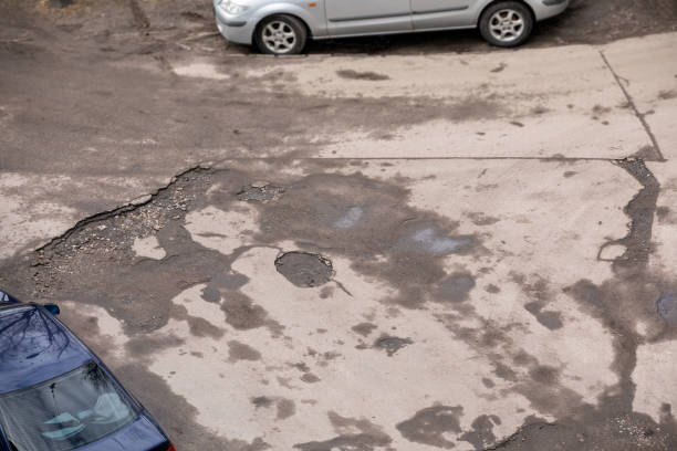 istock Damaged asphalt road with potholes 1137516140