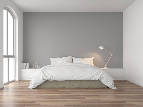 Minimal bedroom with gray wall 3d render Minimal bedroom 3d render,There are wood floor and  gray wall.Furnished with brown fabric bed and white blanket .There are arch shape window nature light shining into the room. bedroom stock pictures, royalty-free photos & images