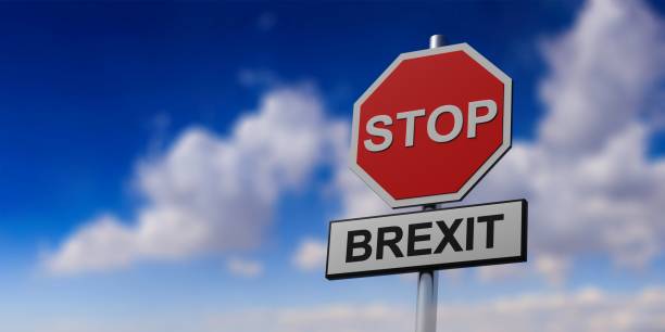 istock Red stop sign and text BREXIT against blue cloudy sky background. 3d illustration 1137518481