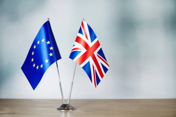 istock European Union and Britain flag standing on the table 1137521065