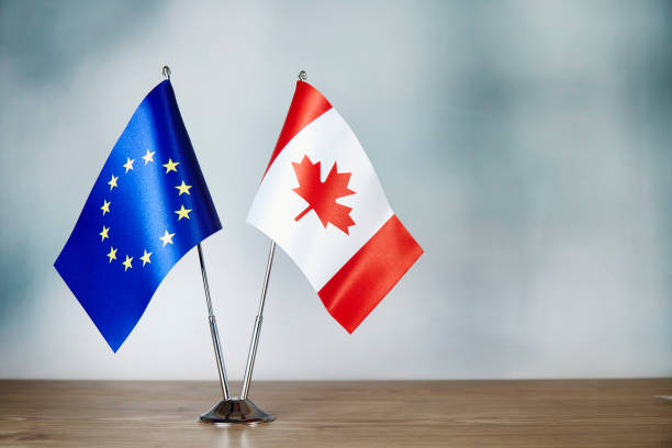 istock European Union and Canada flag standing on the table 1137521090