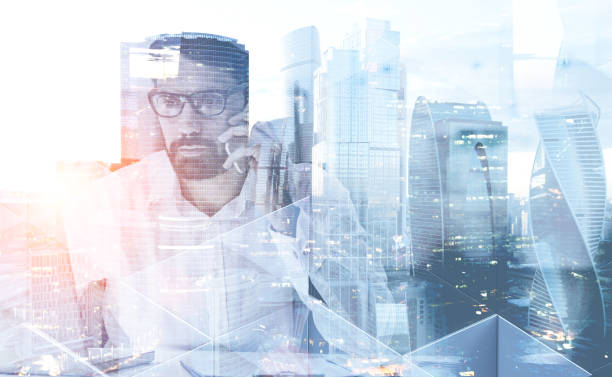 istock Businessman with phone in modern city 1137524493