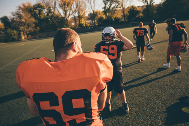 istock Football team on field 1137524504