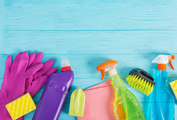 istock Cleaning service concept. Colorful cleaning set for different surfaces in kitchen, bathroom and other rooms. Top view 1137524627