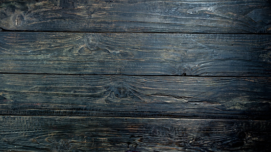 Dark brown textured old wood plank background