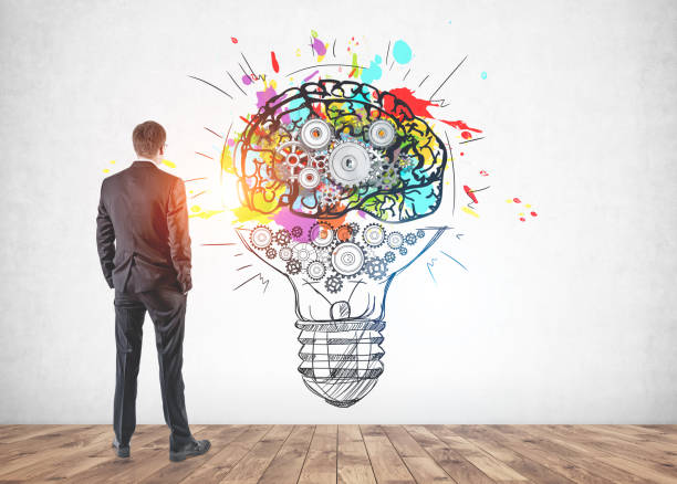 istock Businessman looking at idea sketch 1137525334