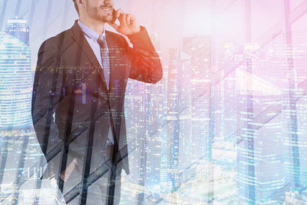 istock Businessman talking on smartphone in night city 1137525907