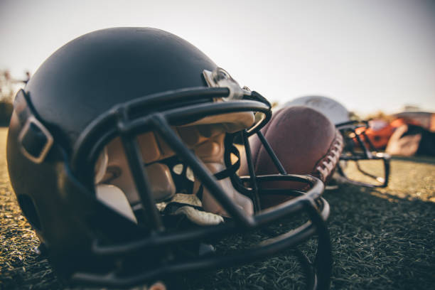 istock Football equipment on grass 1137525945