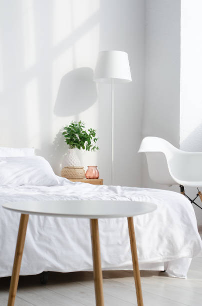 istock Bedroom interior with bed and big indor flower 1137528402