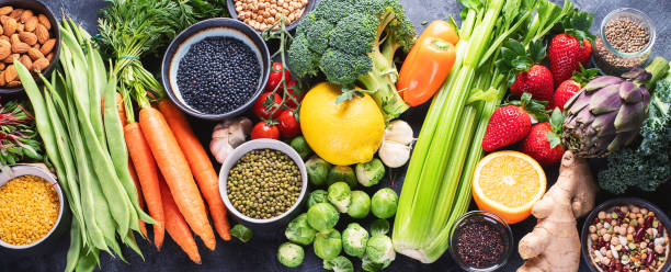 istock Healthy organic food on dark background. 1137529777