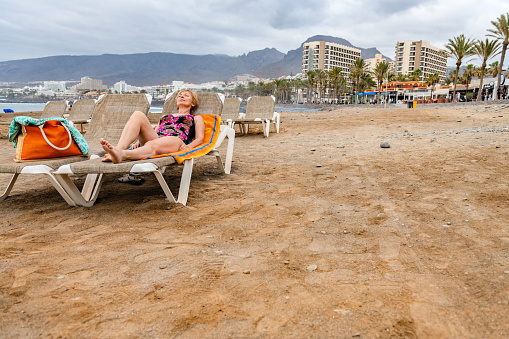 Mature woman enjoys the beach,las Americas, Tenerife, Spain ,Nikon D850